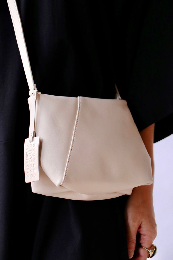 MM6 Maison Margiela Folded J Shoulder Bag in Tapioca | WE ARE ICONIC