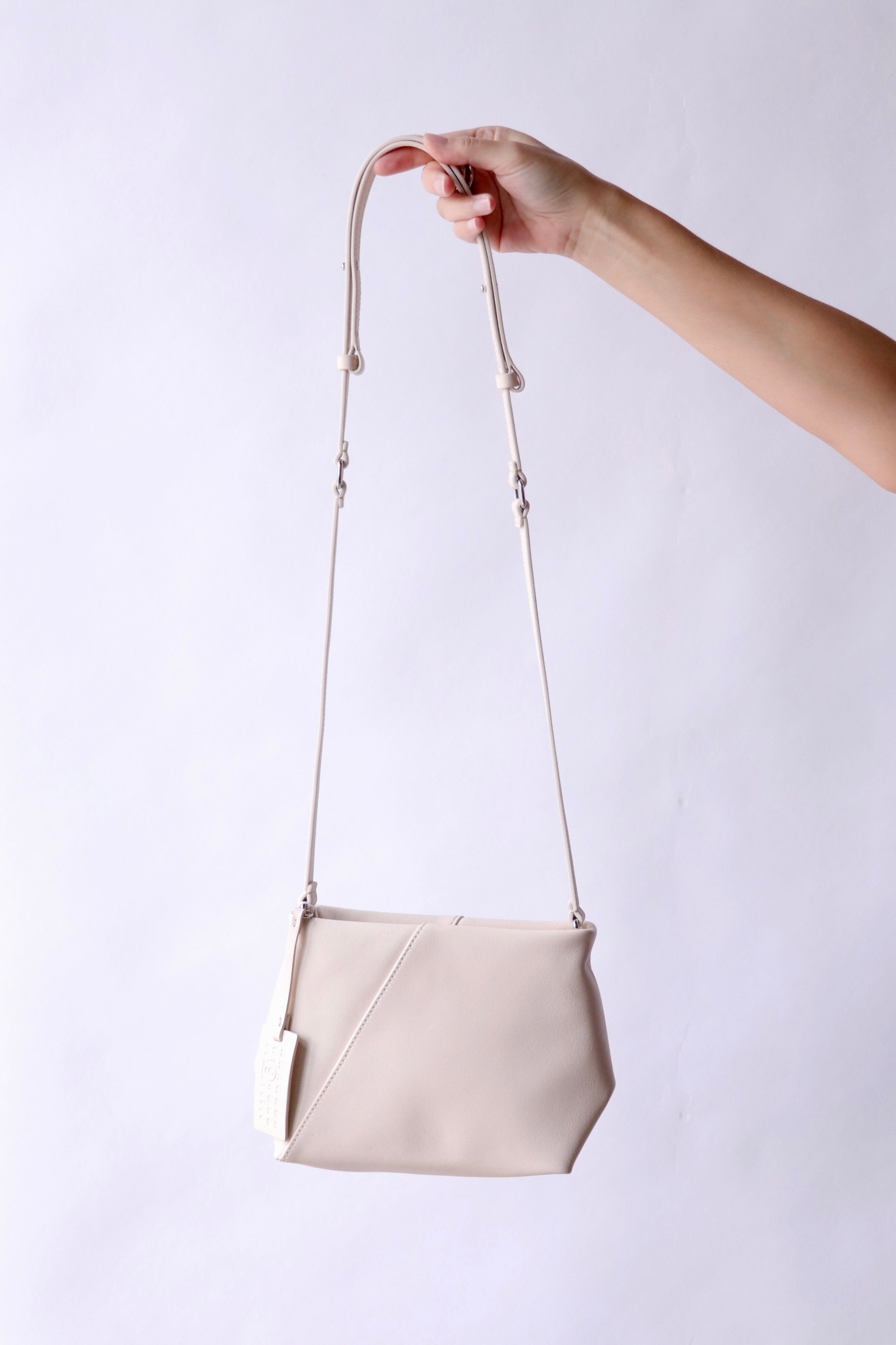MM6 Maison Margiela Folded J Shoulder Bag in Tapioca | WE ARE ICONIC