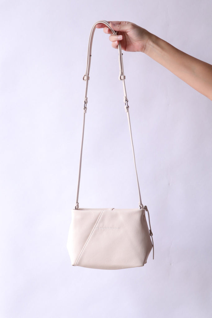 MM6 Maison Margiela Folded J Shoulder Bag in Tapioca | WE ARE ICONIC
