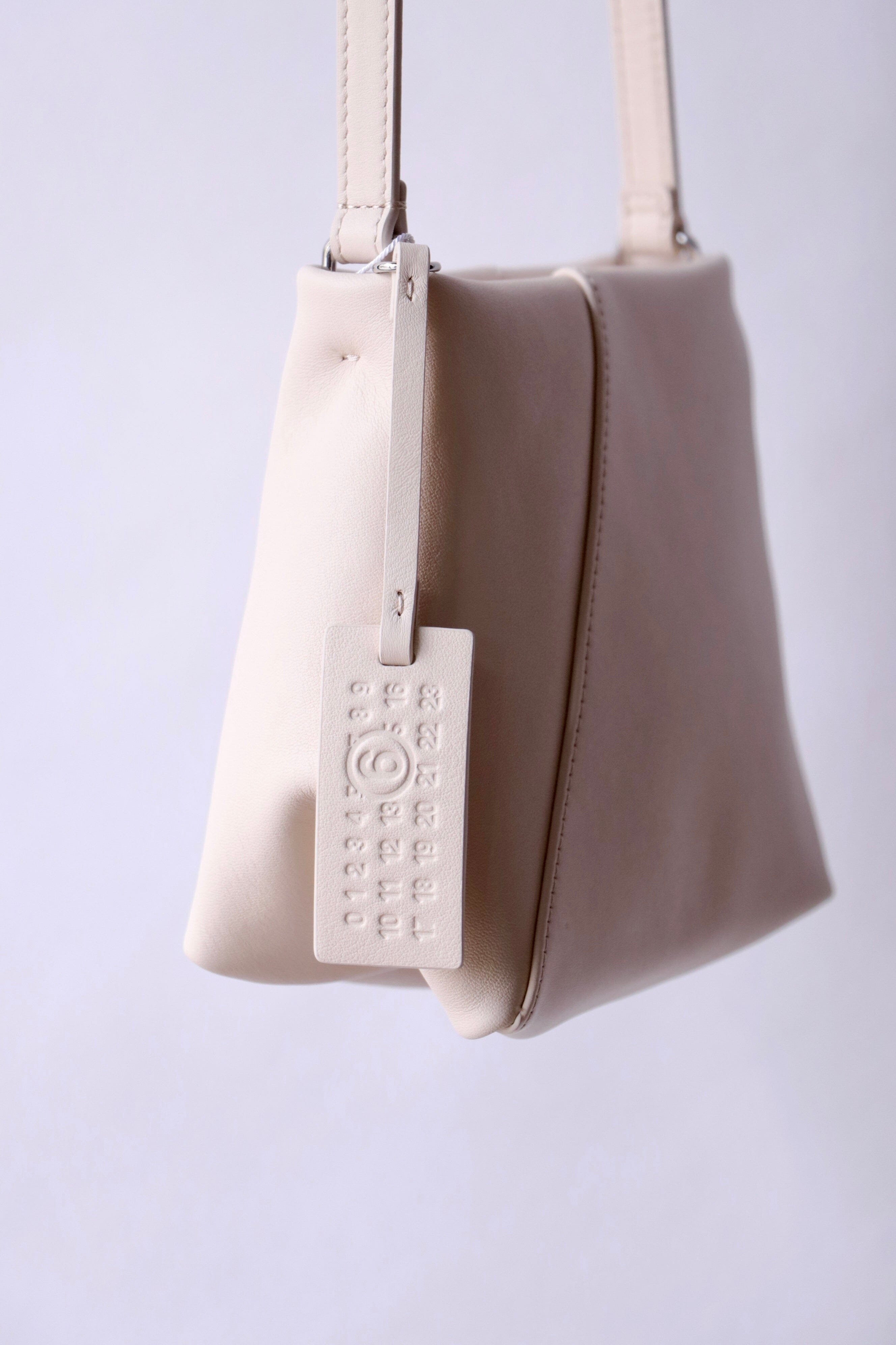 MM6 Maison Margiela Folded J Shoulder Bag in Tapioca | WE ARE ICONIC